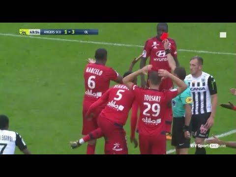 Lyon player flicks yellow card from referee. Gets red card instead