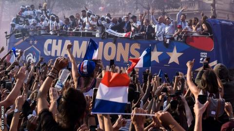 Vive la France! Hundreds of thousands of fans welcome home world champions