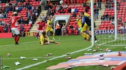 Crisps stop play at Charlton-Fleetwood as fans protest Roland Duchatelet ownership