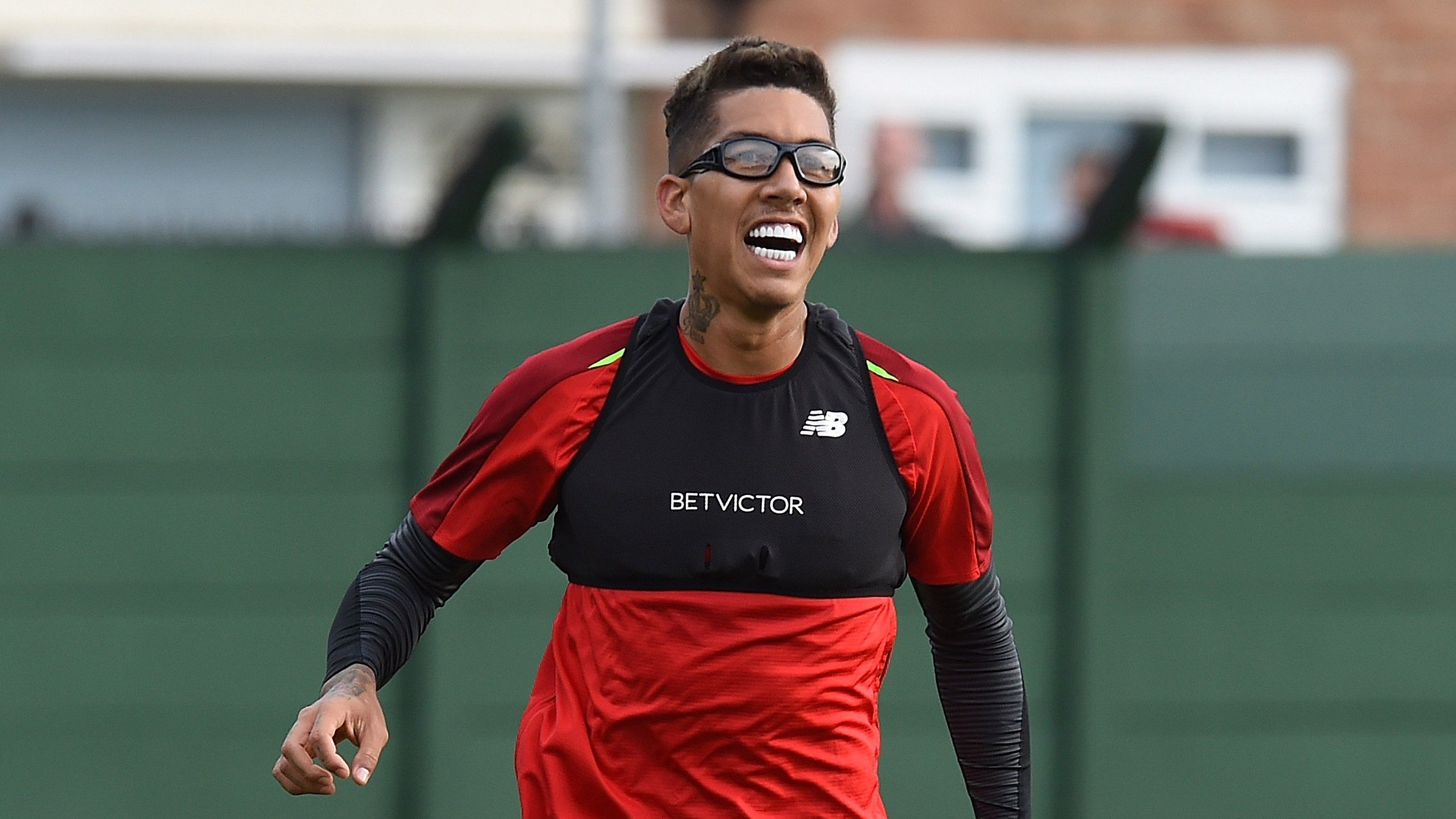 Liverpool's Roberto Firmino wears protective glasses to training