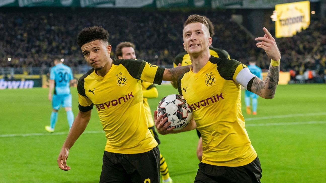Leaders Borussia Dortmund made to sweat for 2-0 win over Freiburg