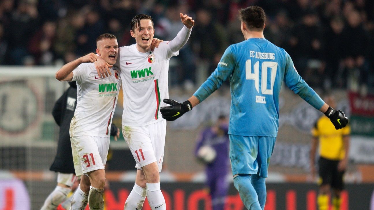 Dortmund shock loss at Augsburg gives Bayern chance to level at top