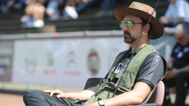 Coach of German fifth-division side TV Jahn Hiesfeld dons fishing gear in protest