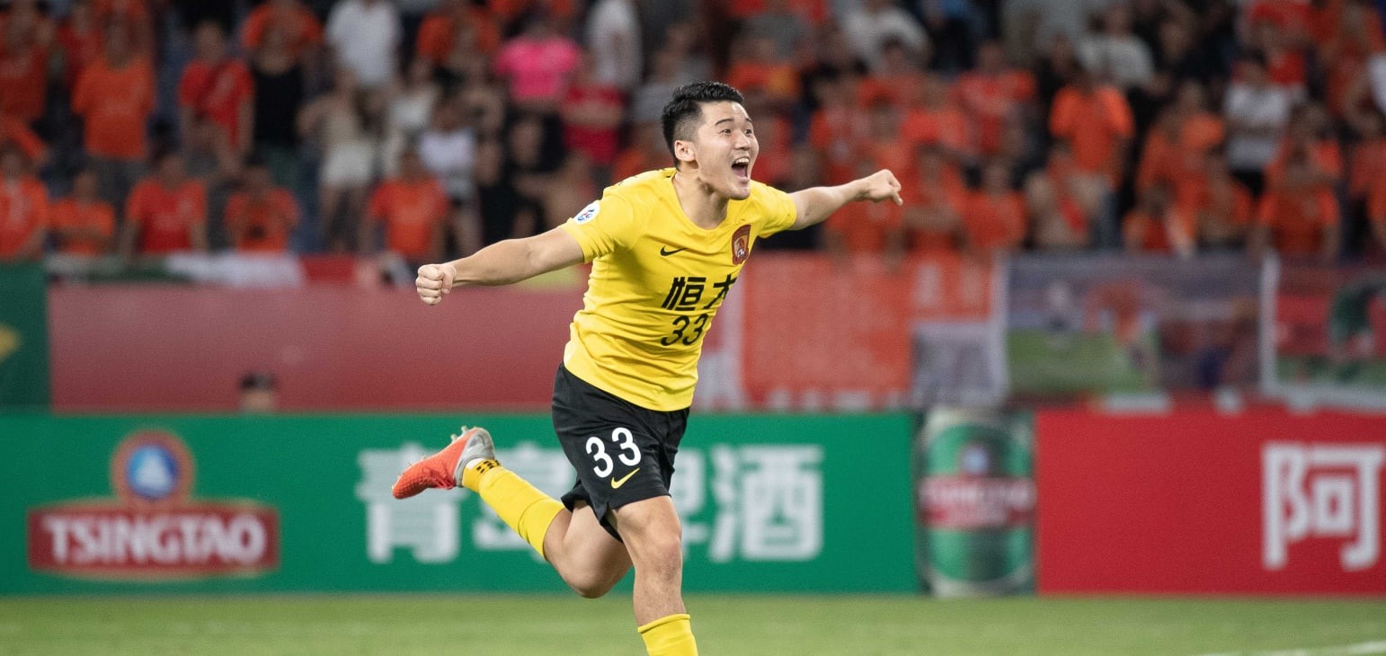 Guangzhou Evergrande win shootout to make last eight
