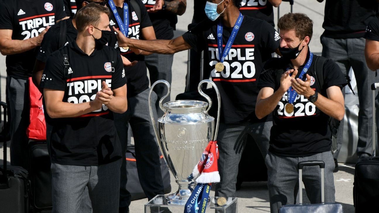 Bayern's Champions League winners return home to low-key welcome