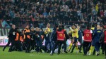 Fans in Turkey charge pitch, players after loss