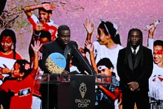 Burna Boy Presents Socrates Award to Saka for Funding 120 Surgeries in Nigeria